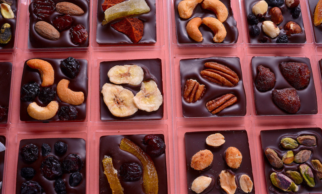 Close up chocolate squares with nuts and fruits